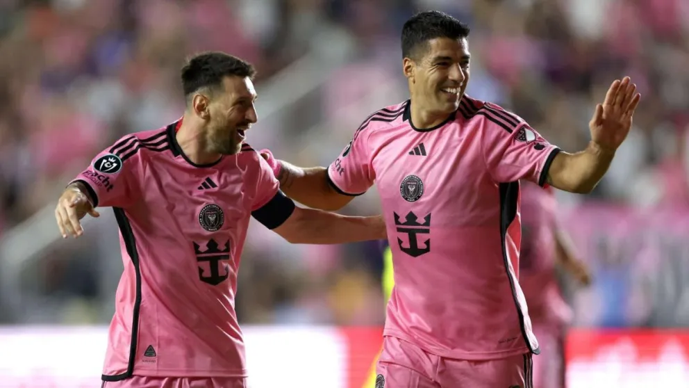 Lionel Messi junto a Luis Suárez.