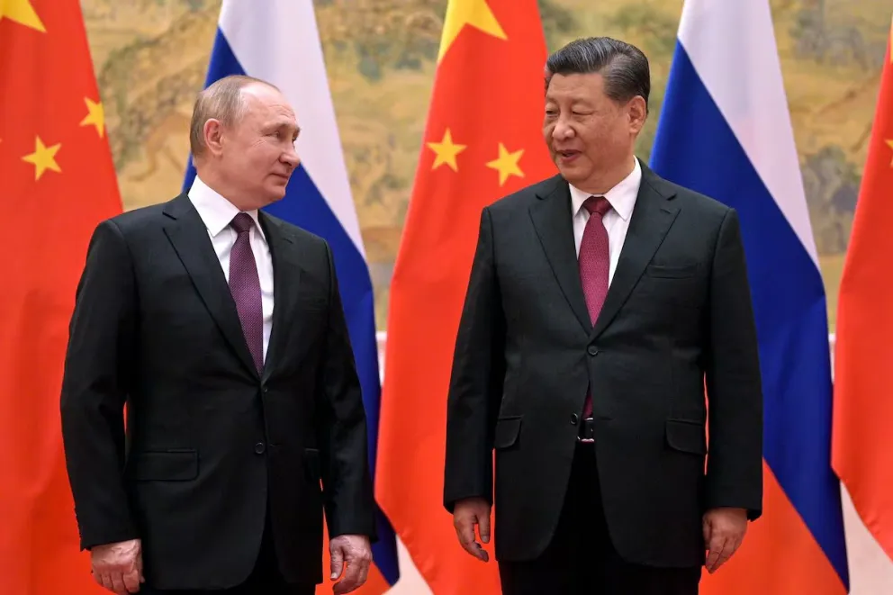 Vladimir Putin junto a Xi Jinping.